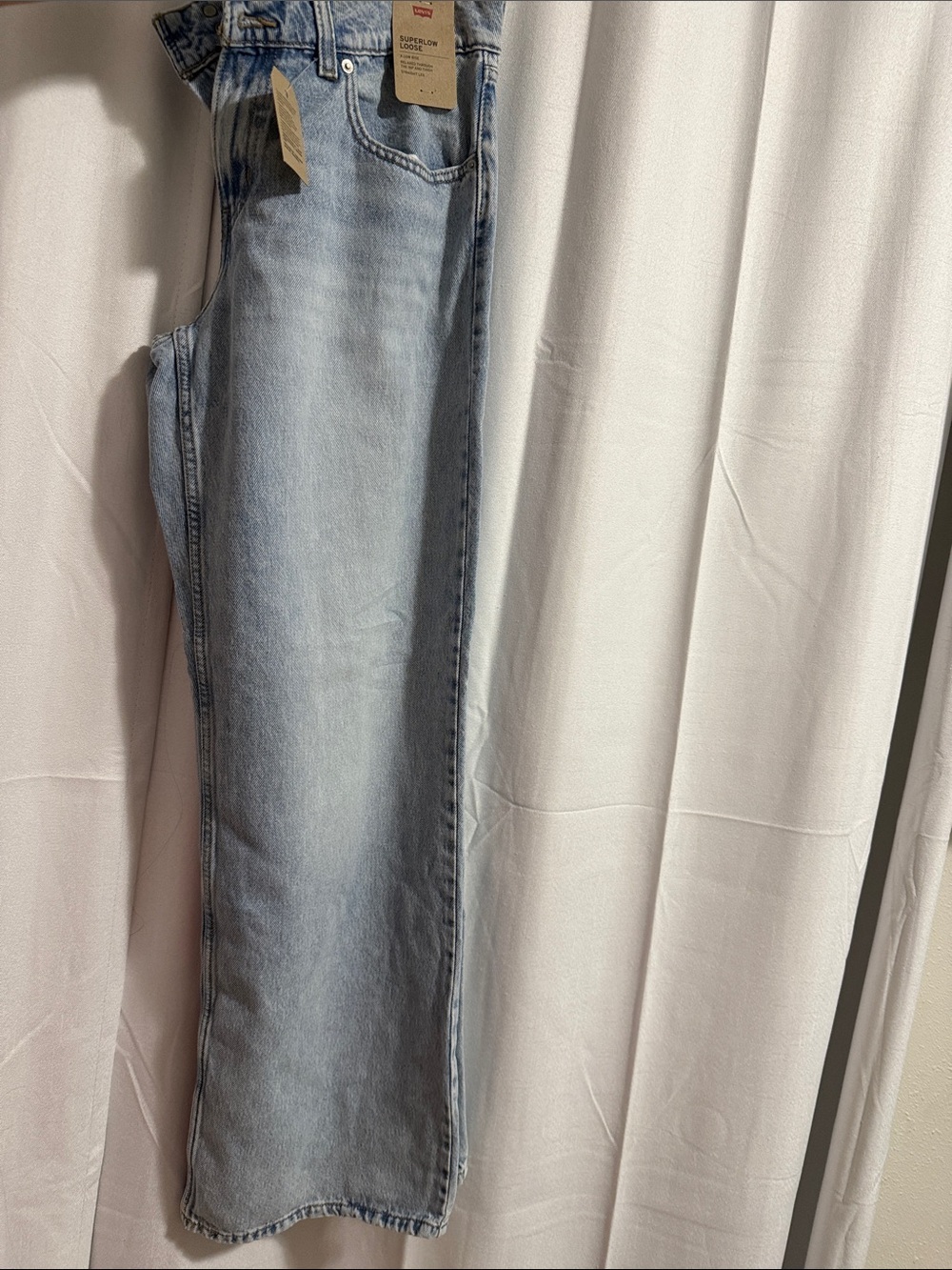 Levis light blue superlow women’s jeans.